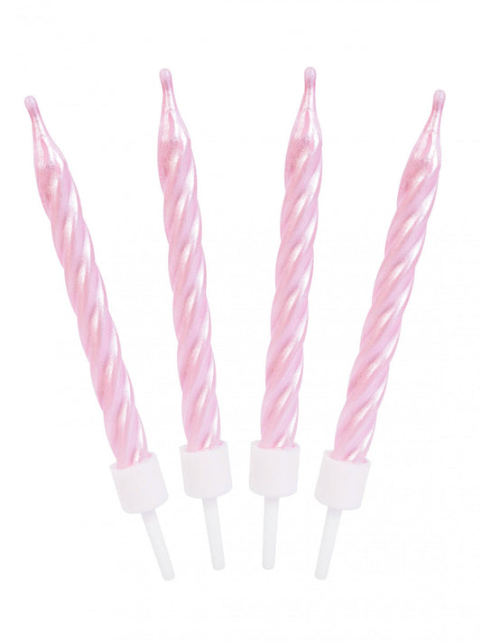Gros plan des bougies d'anniversaire spirales roses nacrées