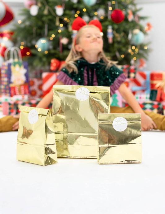 Mise en situation des trois pochettes cadeaux de Noël fête