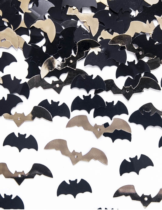 Gros plan des confettis chauve-souris noir et or
