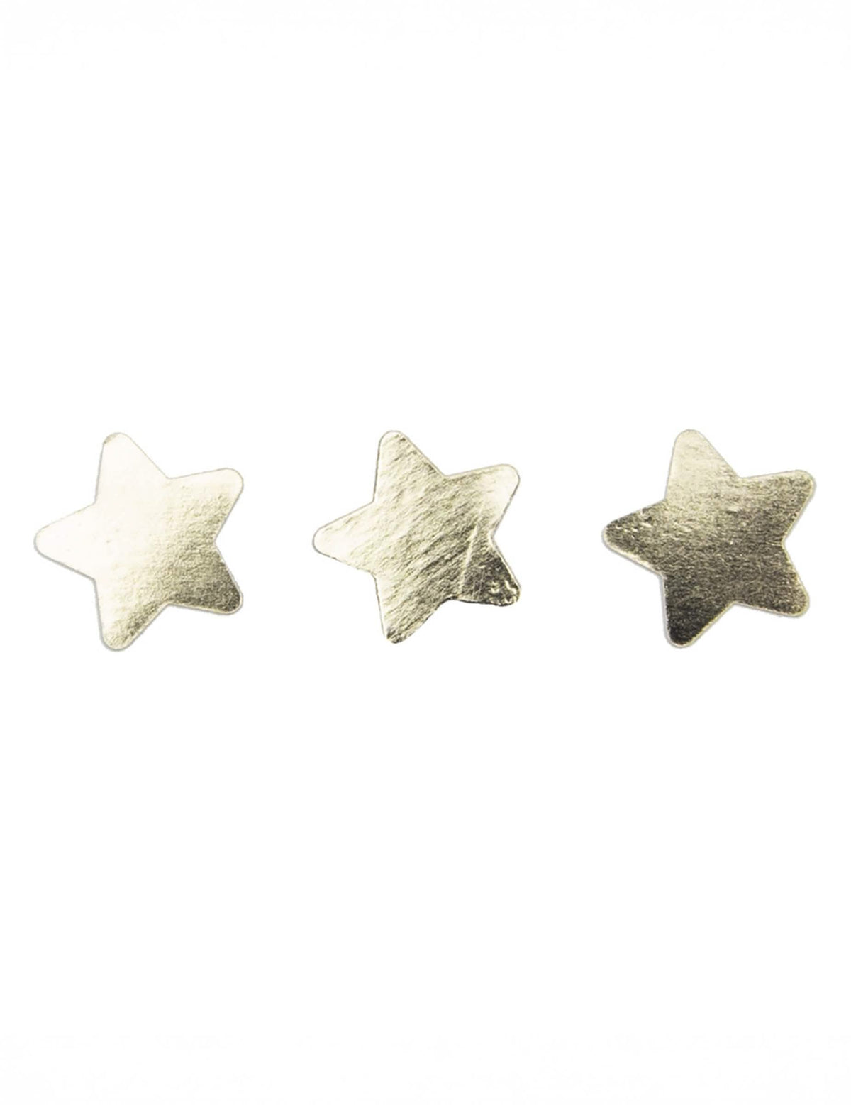 Gros plan sur trois pièces du Confettis de table étoiles pour décoration de fête