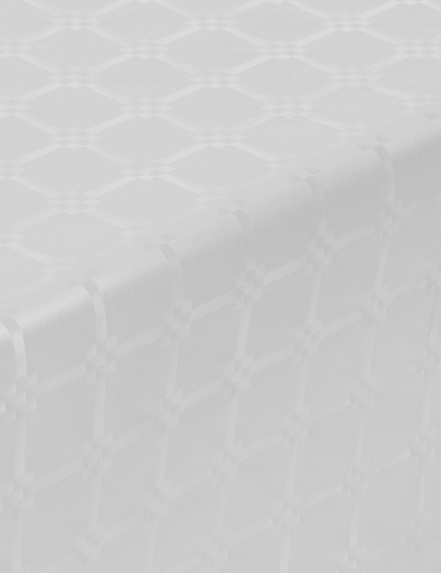Détail du motif damassé de la nappe en rouleau papier damassé blanche