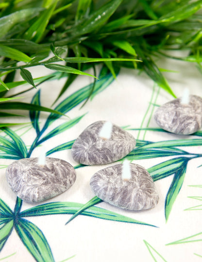 Gros plan sur les bougies déco cailloux zen galets