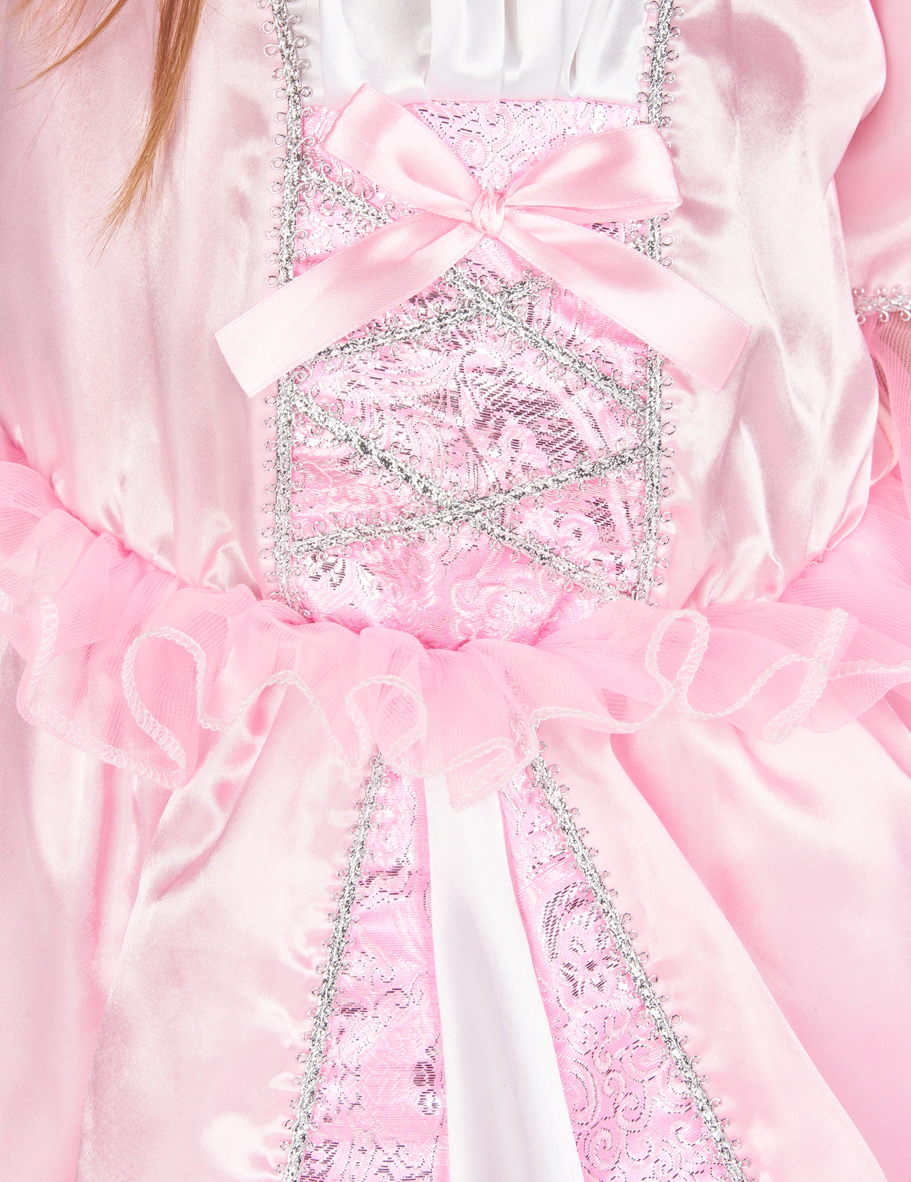 Détail du bustier rose avec nœud et liserés argentés du déguisement de princesse avec couronne à fleurs
